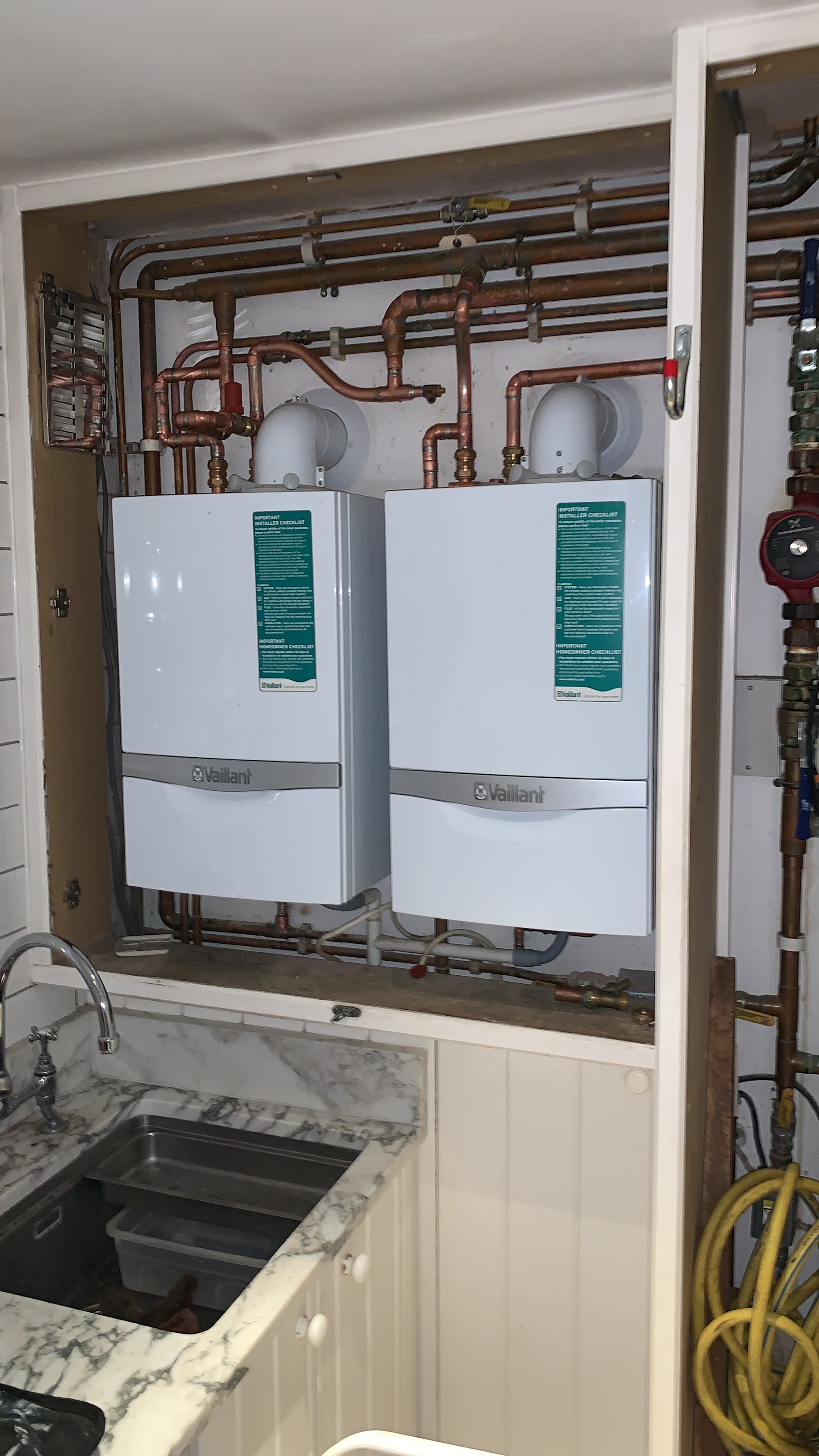 Twin Vaillant boiler installation in a utility room