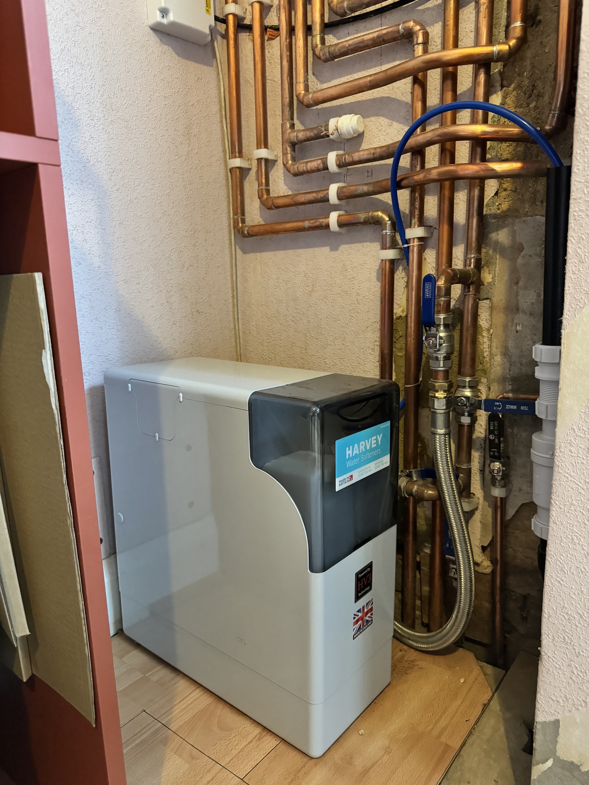 Water softener unit fitted under a kitchen sink